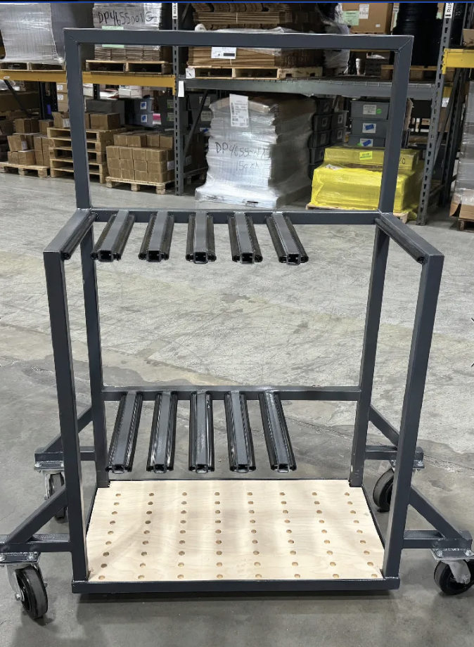 Upright Arrangement: Custom carts hold extrusions vertically, reducing work space needs and improving safety for fabricator