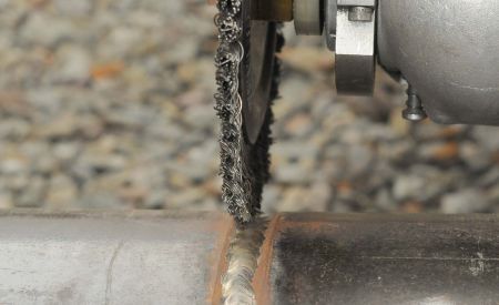 Brushes keep welds clean, costs down