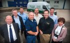 Camfil Farr APC president Lee Morgan (third from right) and European sales director Rick Kreczmer (second from right) gather with other company representatives and local officials outside its planned 40,000-sq.-ft. Heywood facility.